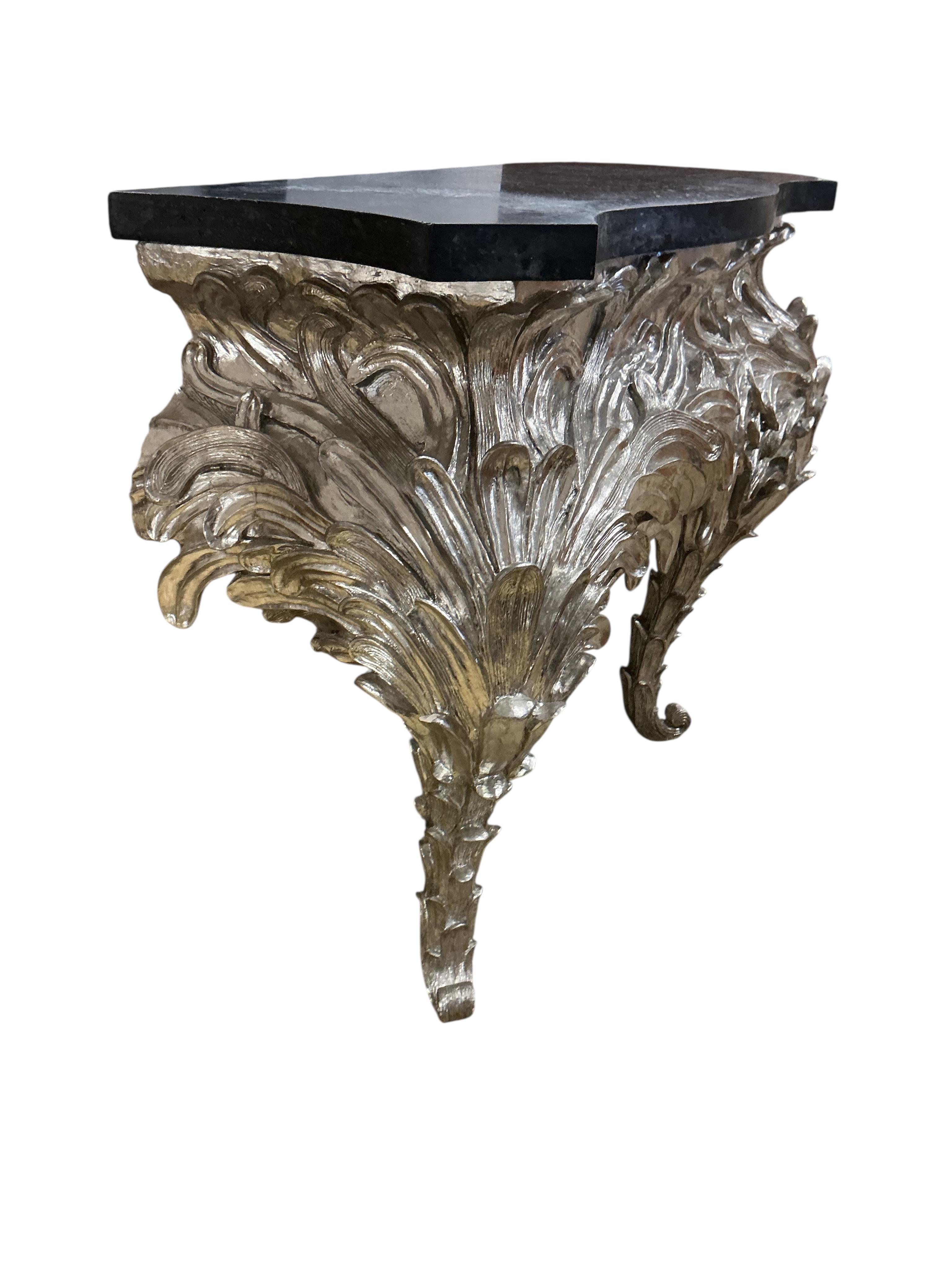 A pair of contemporary silvered composition serpentine 